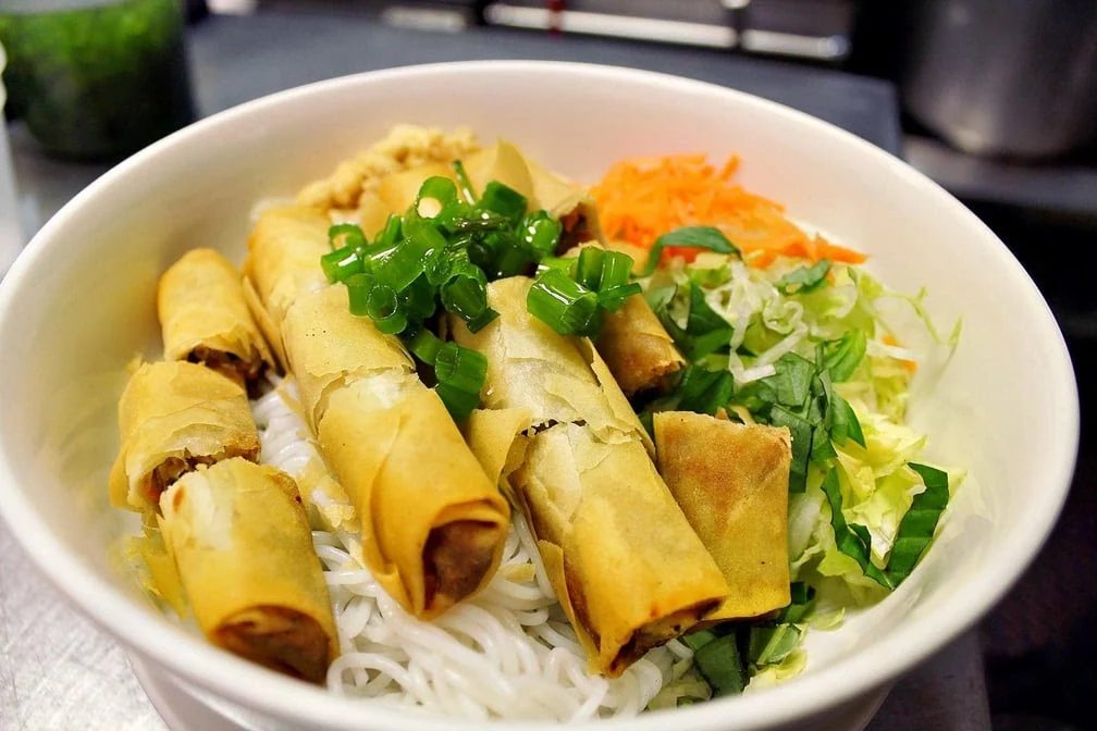 Vietnamese cuisine specialties - bánh mì, spring rolls and bún bowls at Pho Ngon